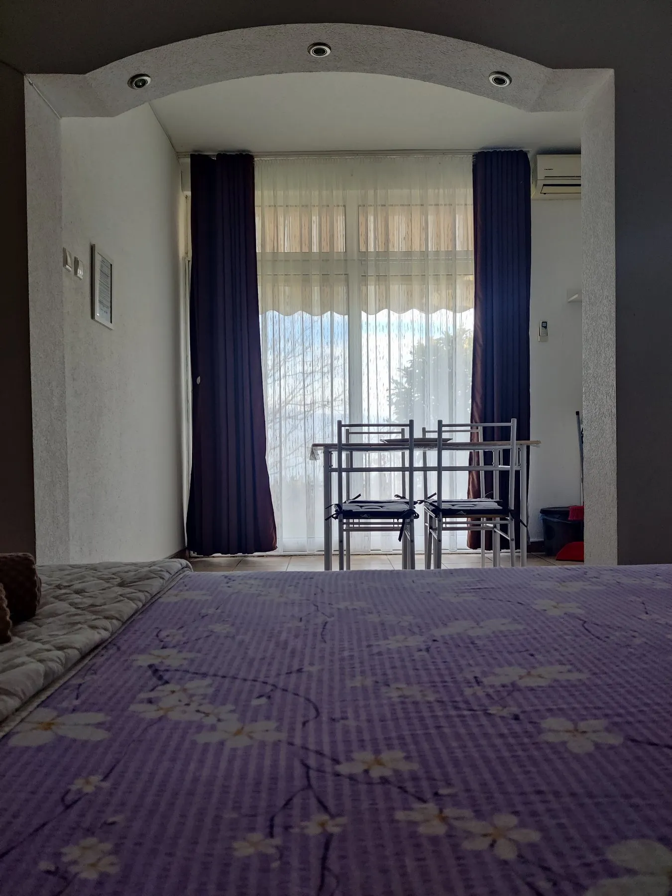 Sunlit Ground Floor apartment bedroom with three beds and a bright window
